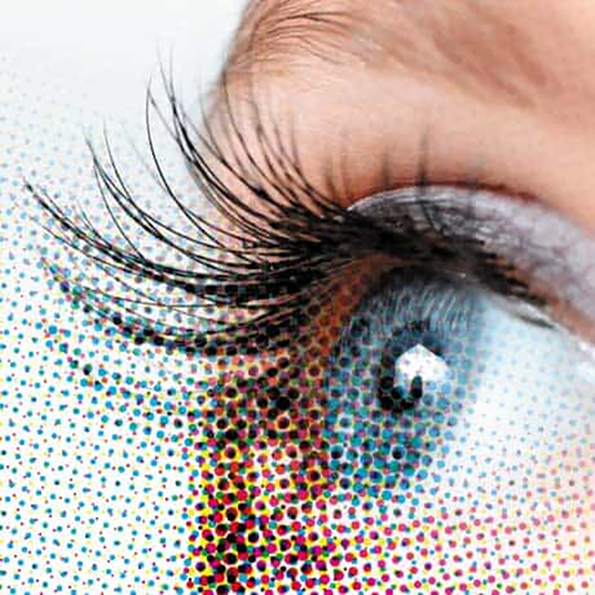 Closeup picture of the human eye simulates pixels becoming halftone spot dots in printing